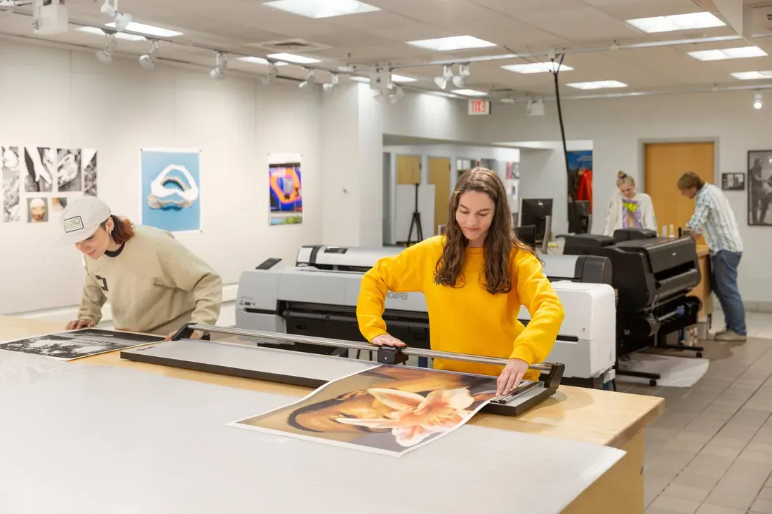 Student working at the state-of-the-art digital lab at Light Work inside the Robert B. Menschel Media center at Watson Hall.